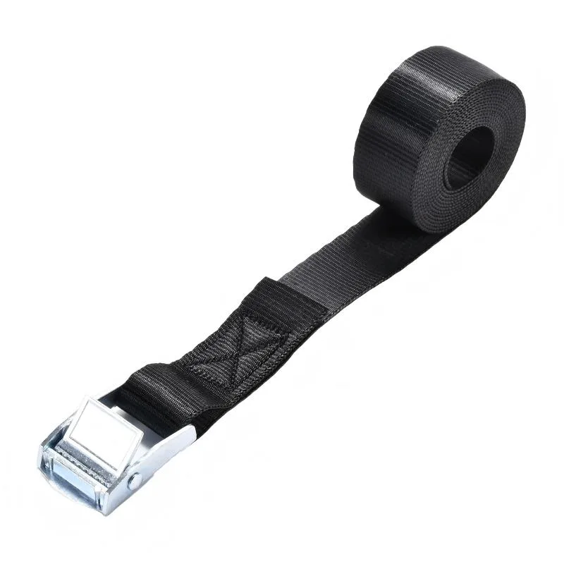 Quick release cinch strap securing a kayak on an SUV roof